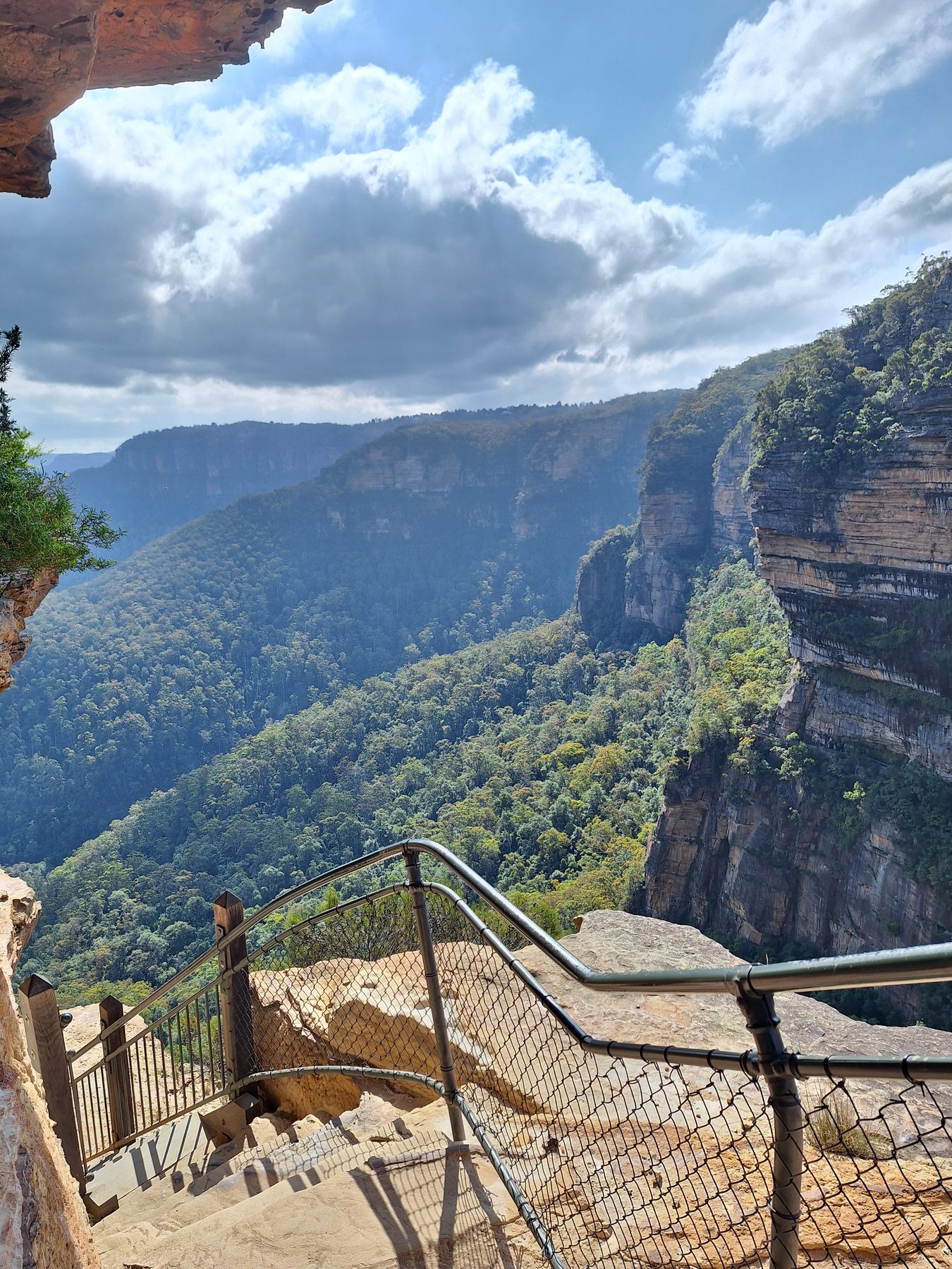 Metal steps and railings of the Giant Stairway descending a cliff into the Jamison Valley