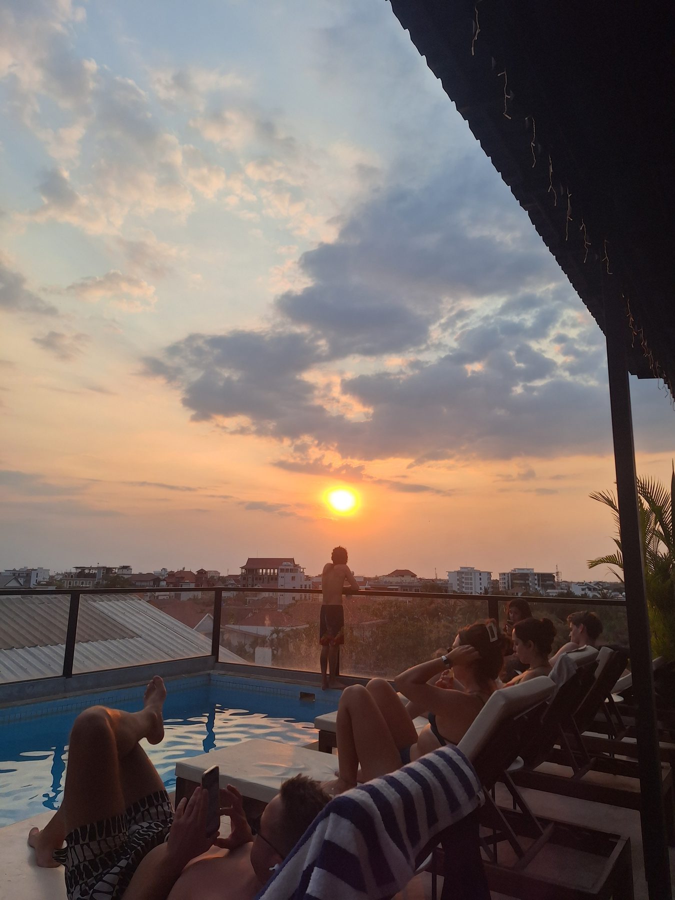 A rooftop pool at sunset in Siem Reap, Cambodia