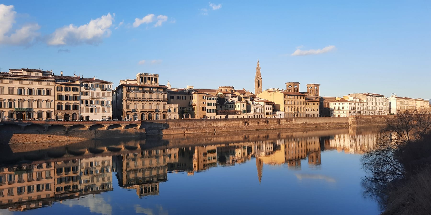 Palaces along the Arno in Florence reflected in still water
