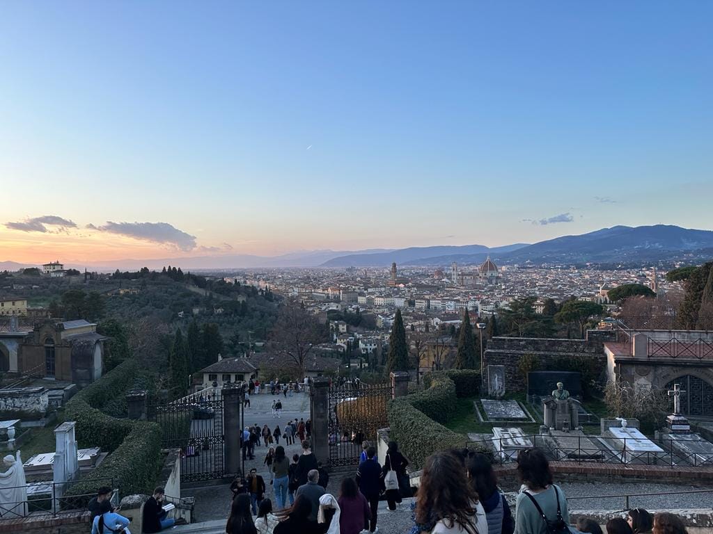 A view across the rooftops of Florence towards the hills from the high ground south of the Arno at dusk