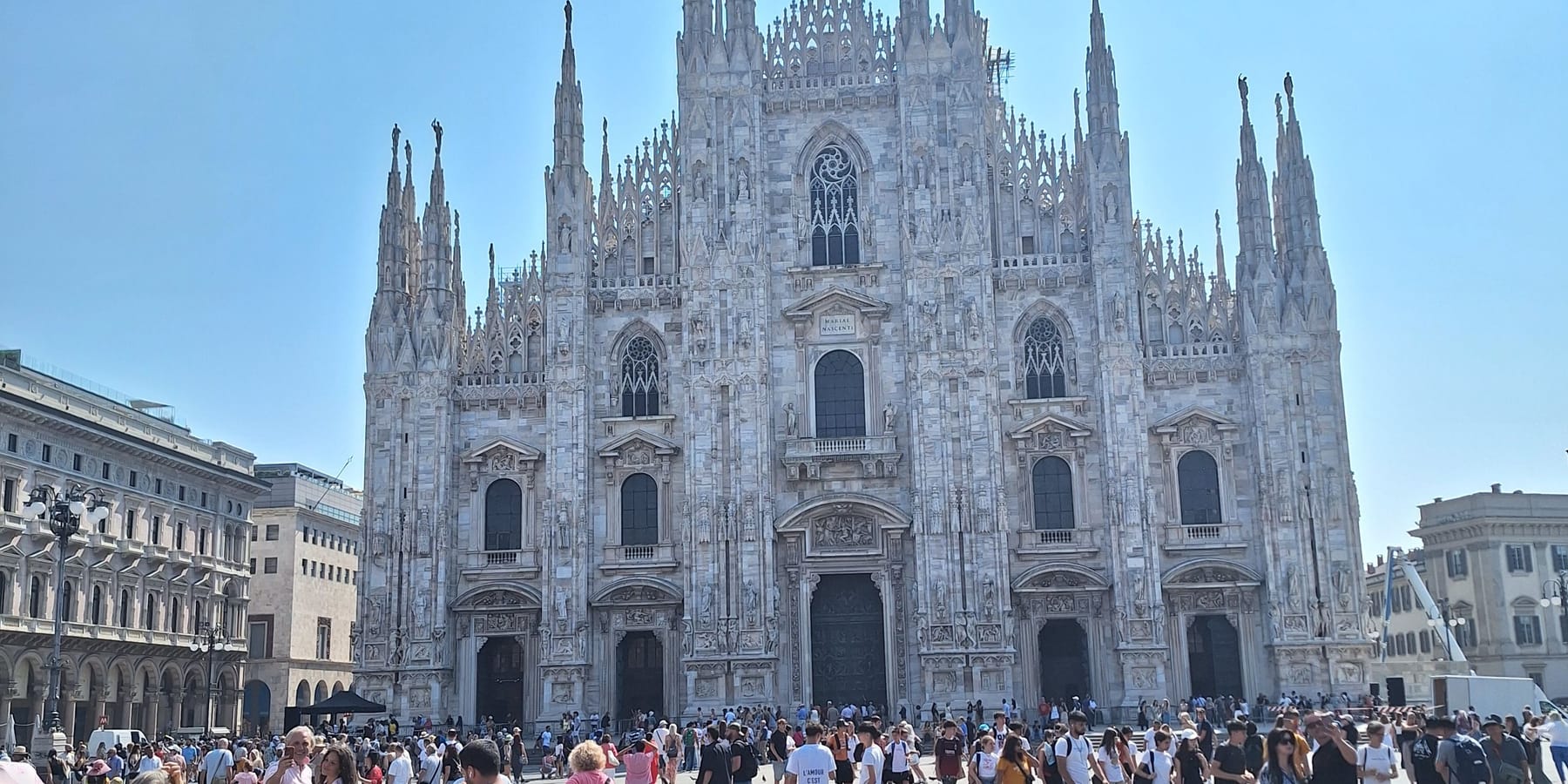 The white marble façade and spires of Milan's Duomo