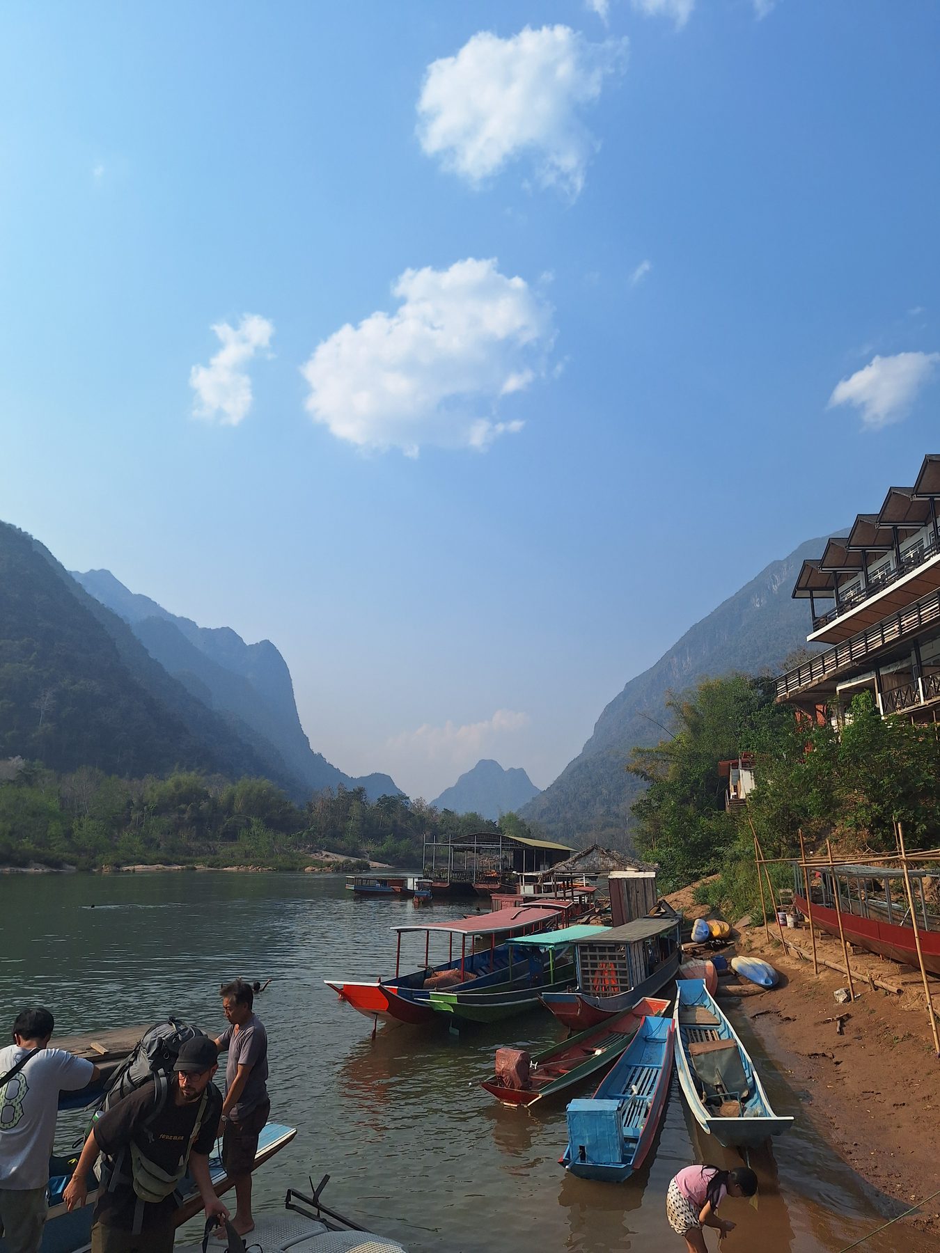 Longtail boats moored on the Nam Ou river at a village landing