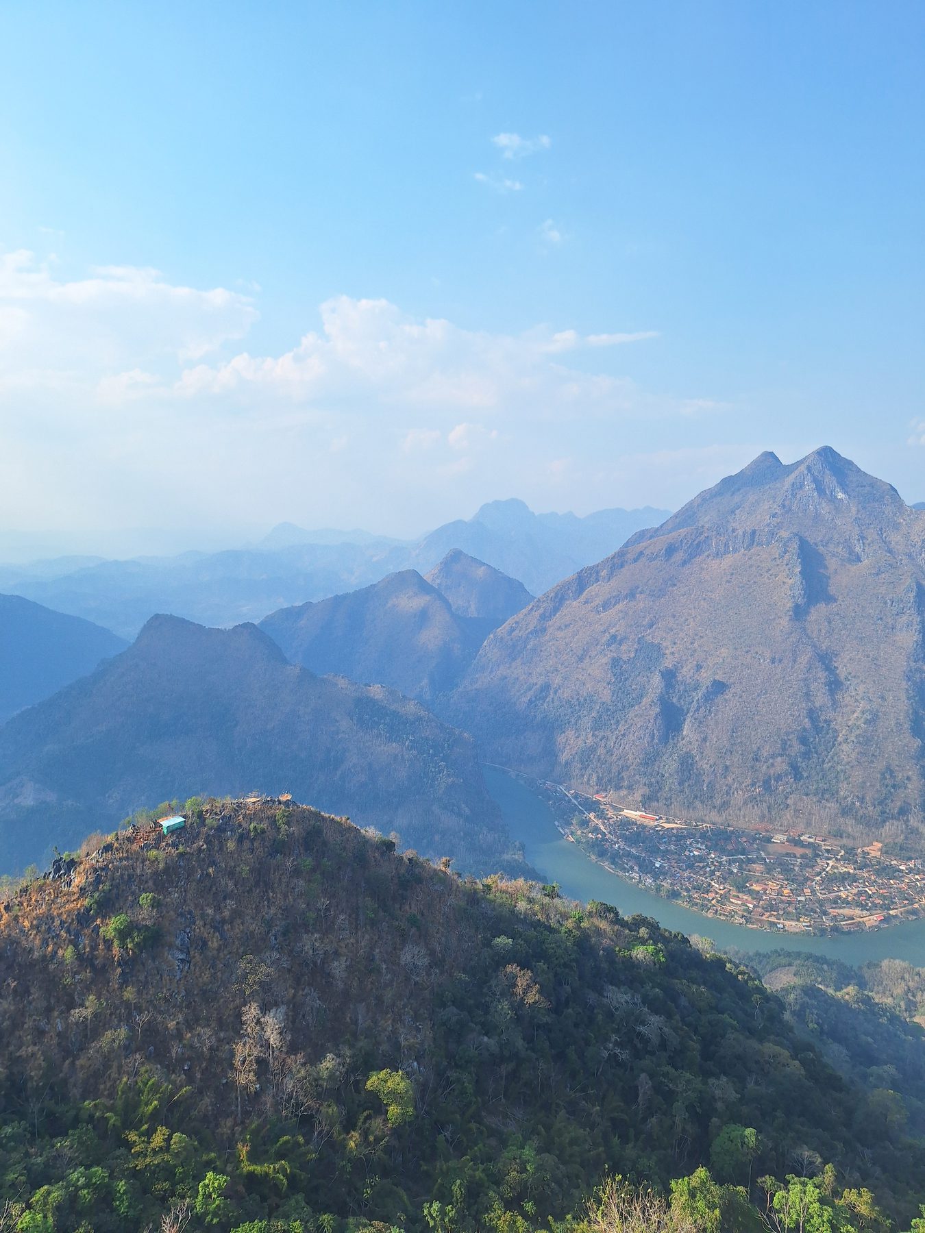 The Nam Ou river and Nong Khiaw village seen far below from the Pha Daeng Peak viewpoint