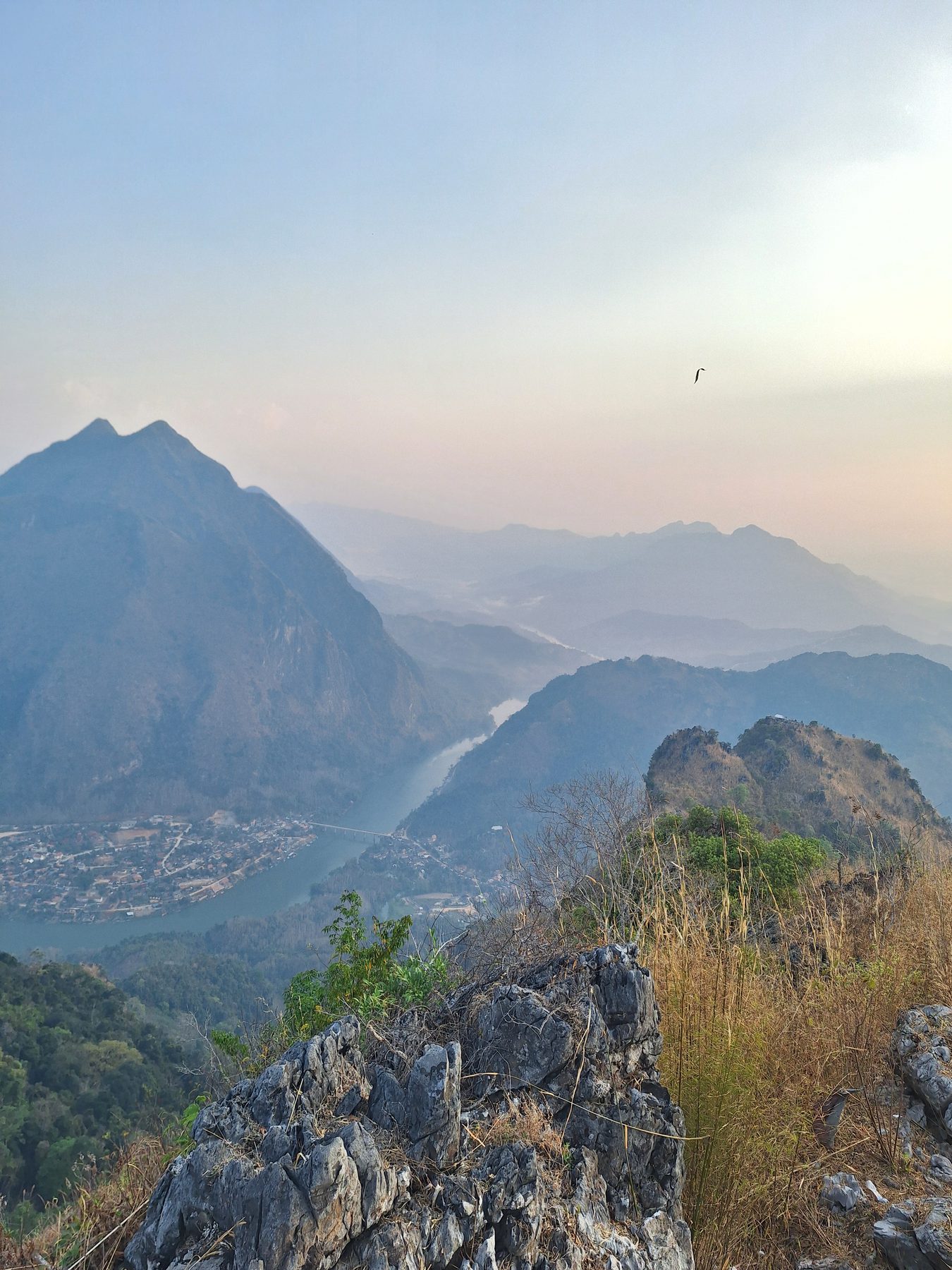 Mist over the Nam Ou river valley at sunrise from a peak above Nong Khiaw