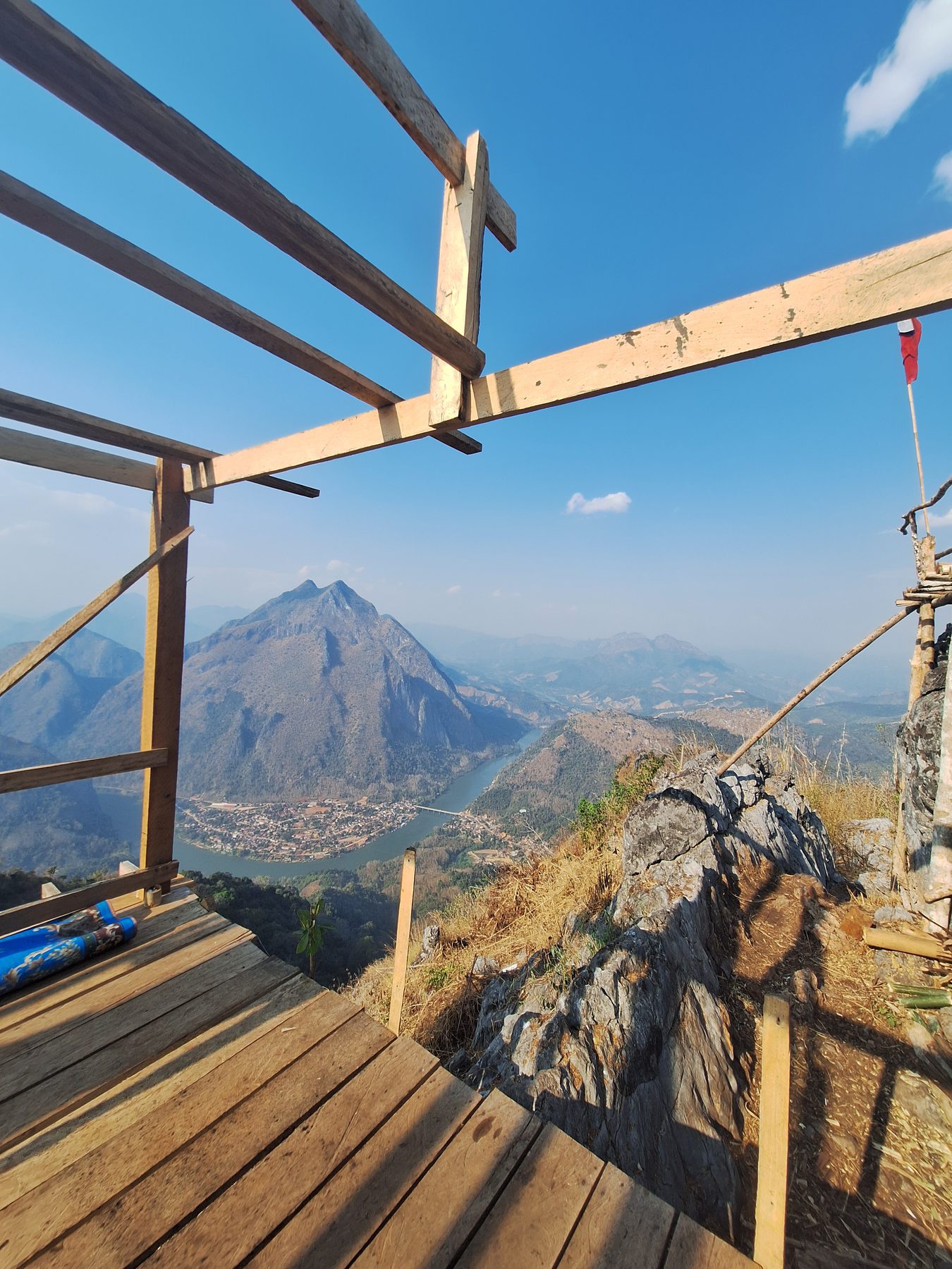 A wooden viewing platform on a peak above Nong Khiaw