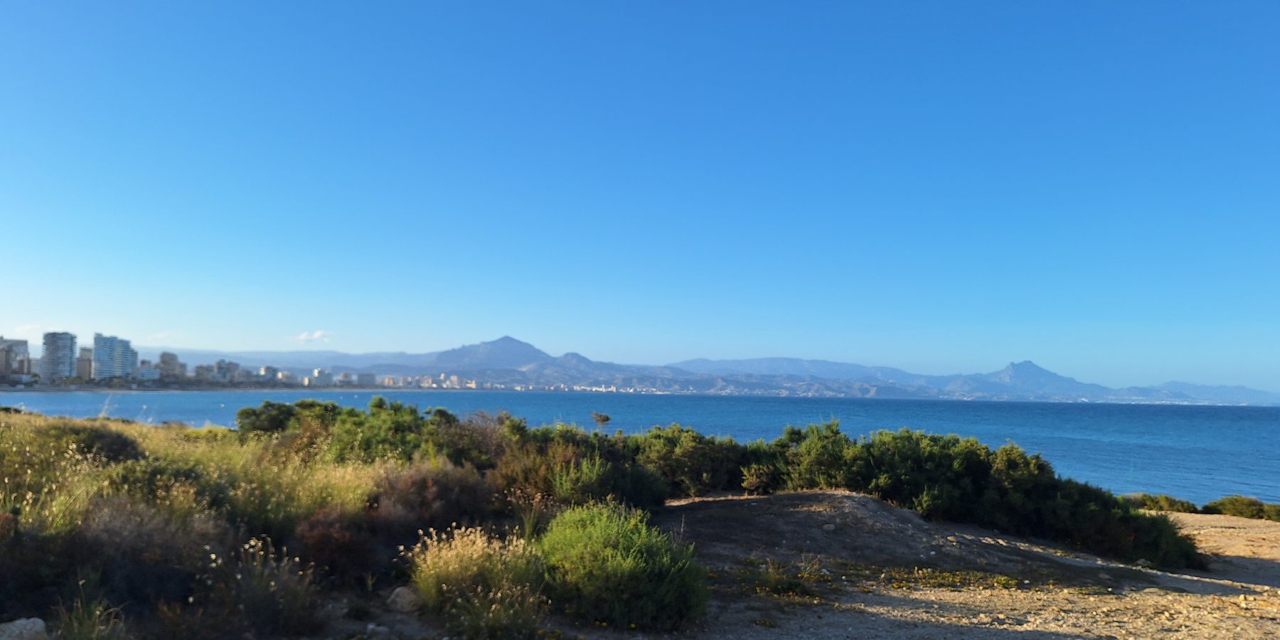 The bay at Alicante with mountains rising behind the city