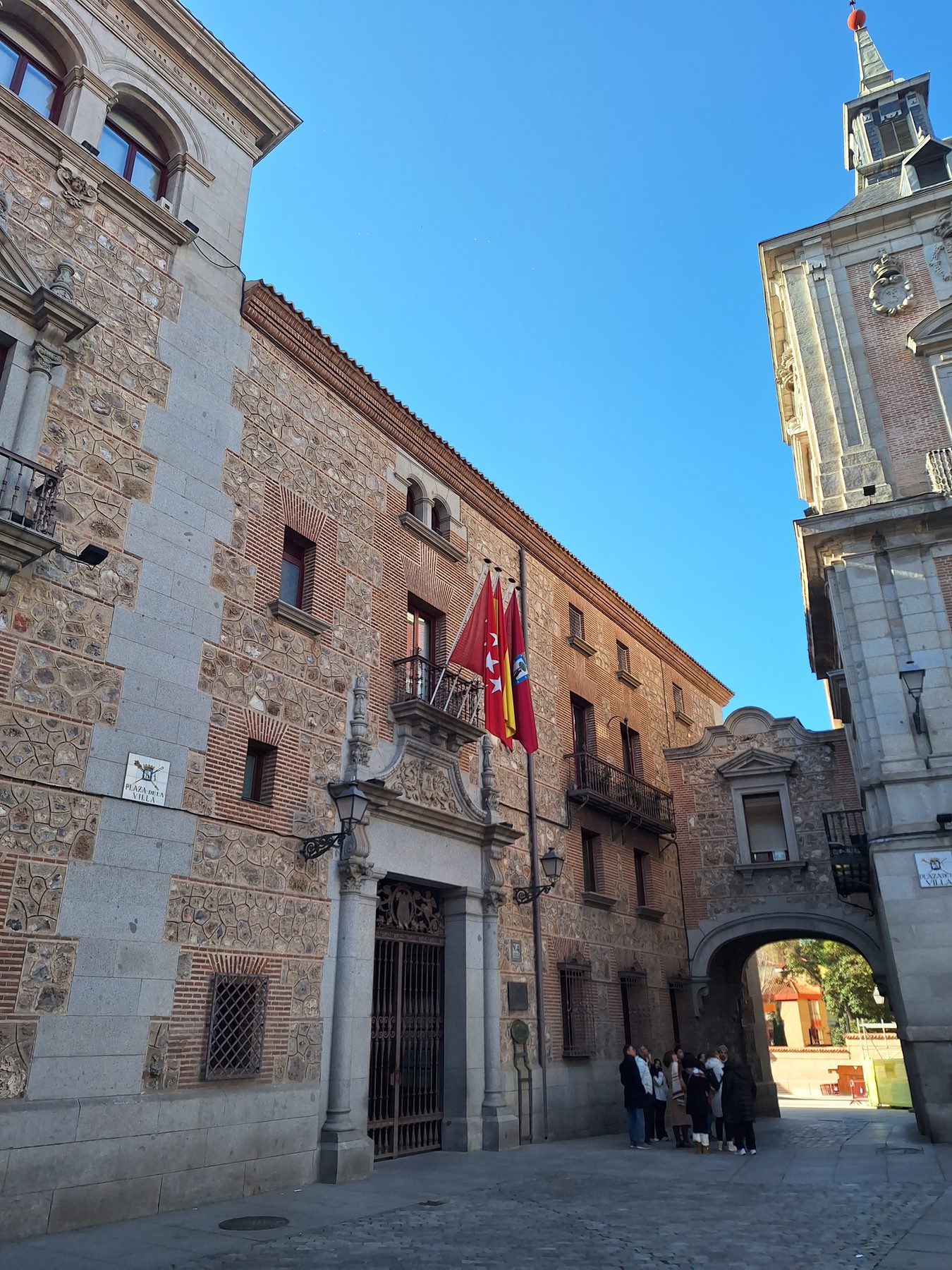 The stone buildings and clock tower of the Plaza de la Villa in central Madrid