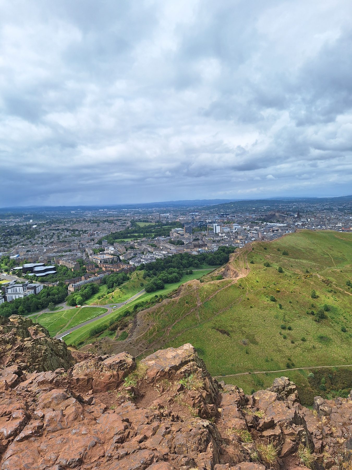 Looking out over Edinburgh from the grassy volcanic hills of Holyrood Park