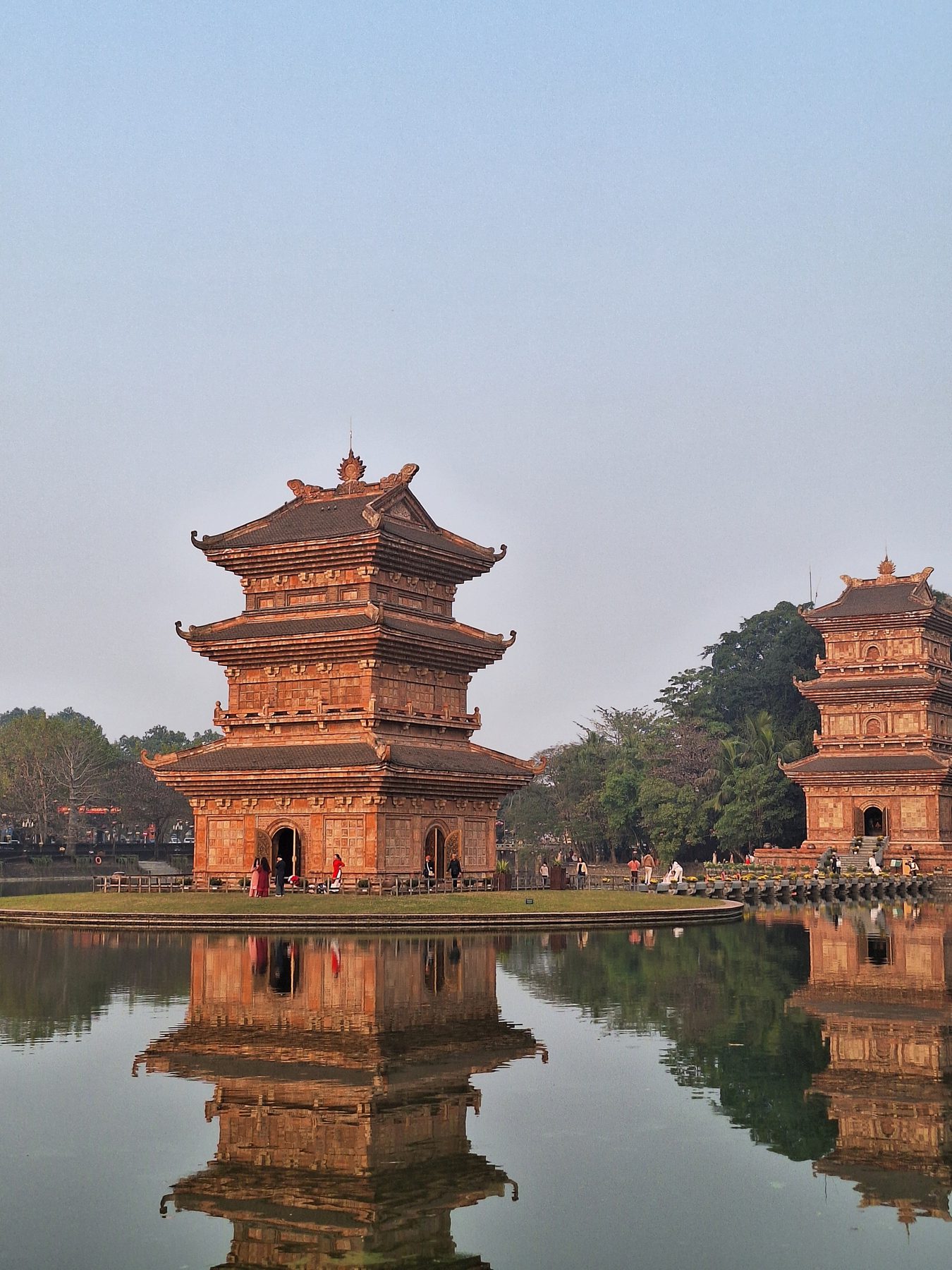 A tiered pagoda tower beside water at Ninh Binh, Vietnam